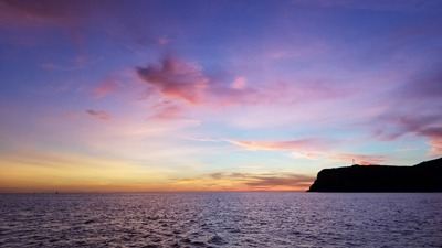 Colorful sunset over the ocean and coastal cliffs