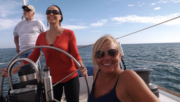 Friends sailing on a boat in sunny weather