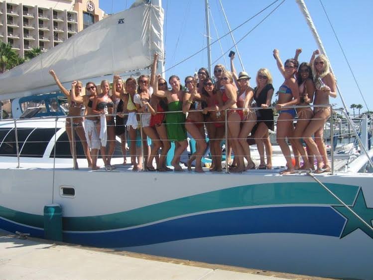 Group of women celebrating on a yacht