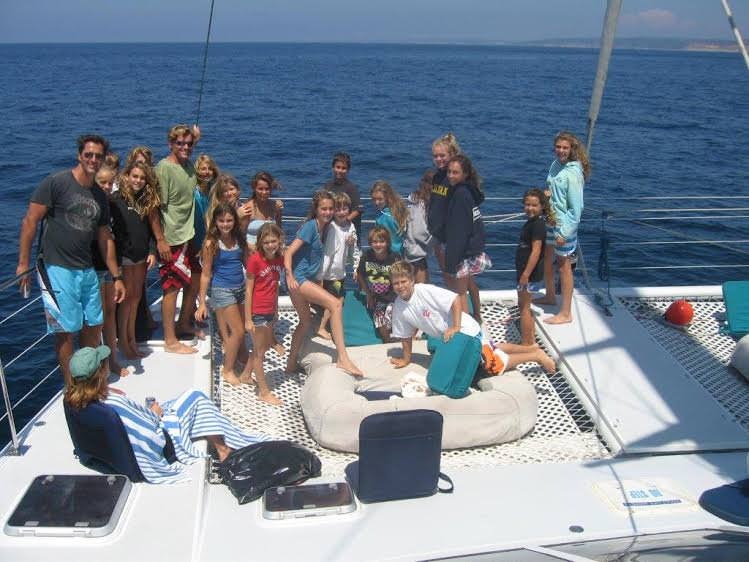 Group of people enjoying a sunny boat trip