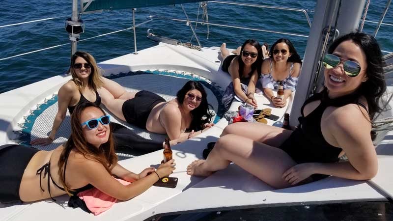 Friends relaxing on a boat in sunny weather