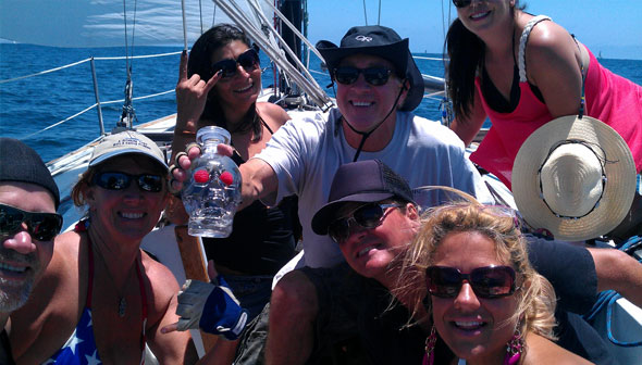 Friends enjoying a sunny sailing trip together