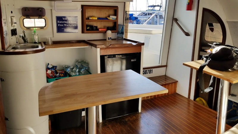 Compact boat kitchen and dining area interior