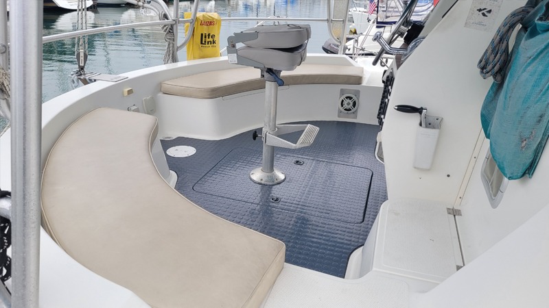 Clean sailboat cockpit with seating and helm station