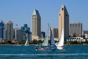 downtown1-300x199 Sailboats on water before city skyline