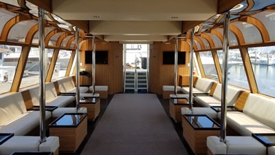 Luxury boat interior with seating and large windows