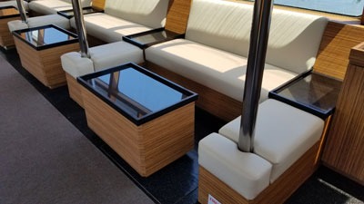 Modern wooden seating area with glass tables