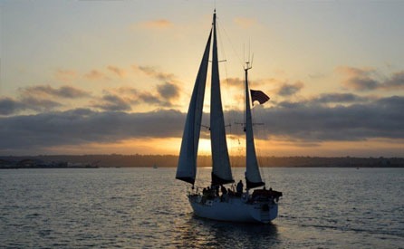Sailboat on the ocean at sunset