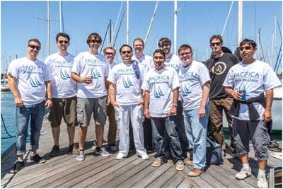 Group of sailors posing on marina dock