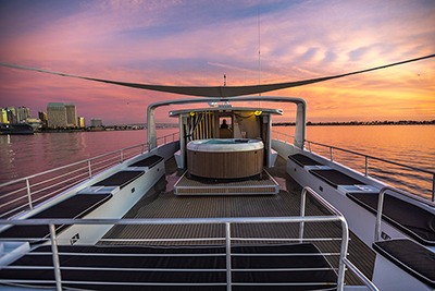 Luxury yacht deck at sunset on calm water