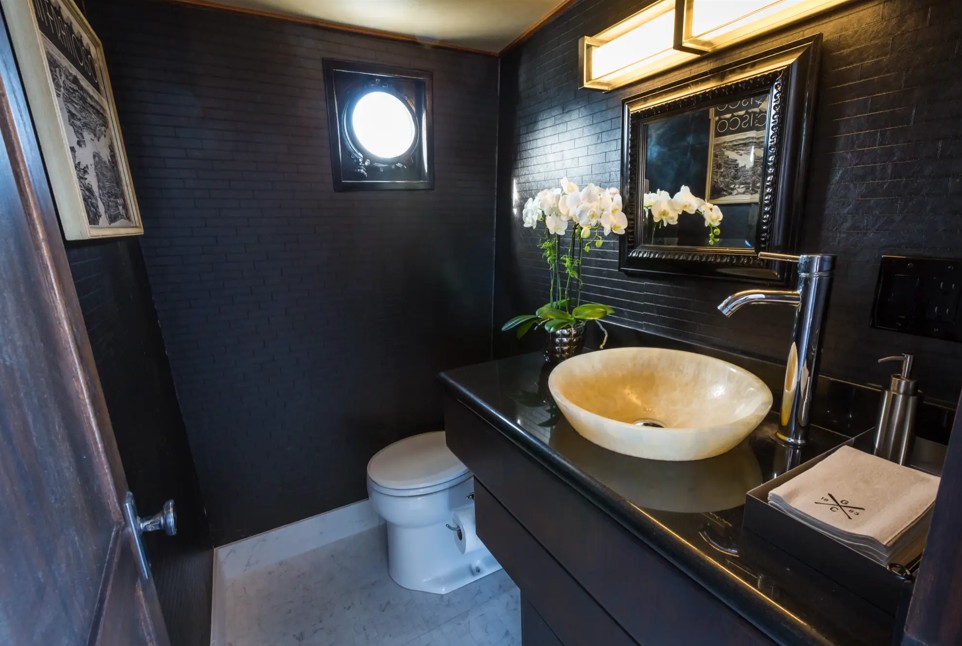 100_luxury_yacht_pacifica4 Elegant bathroom with vessel sink and orchids.